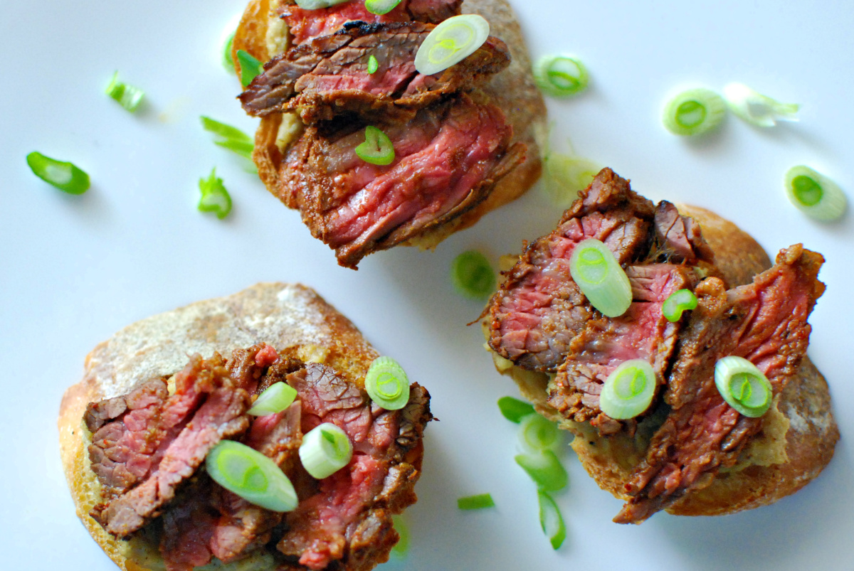 Red curry steak and cauliflower crostini