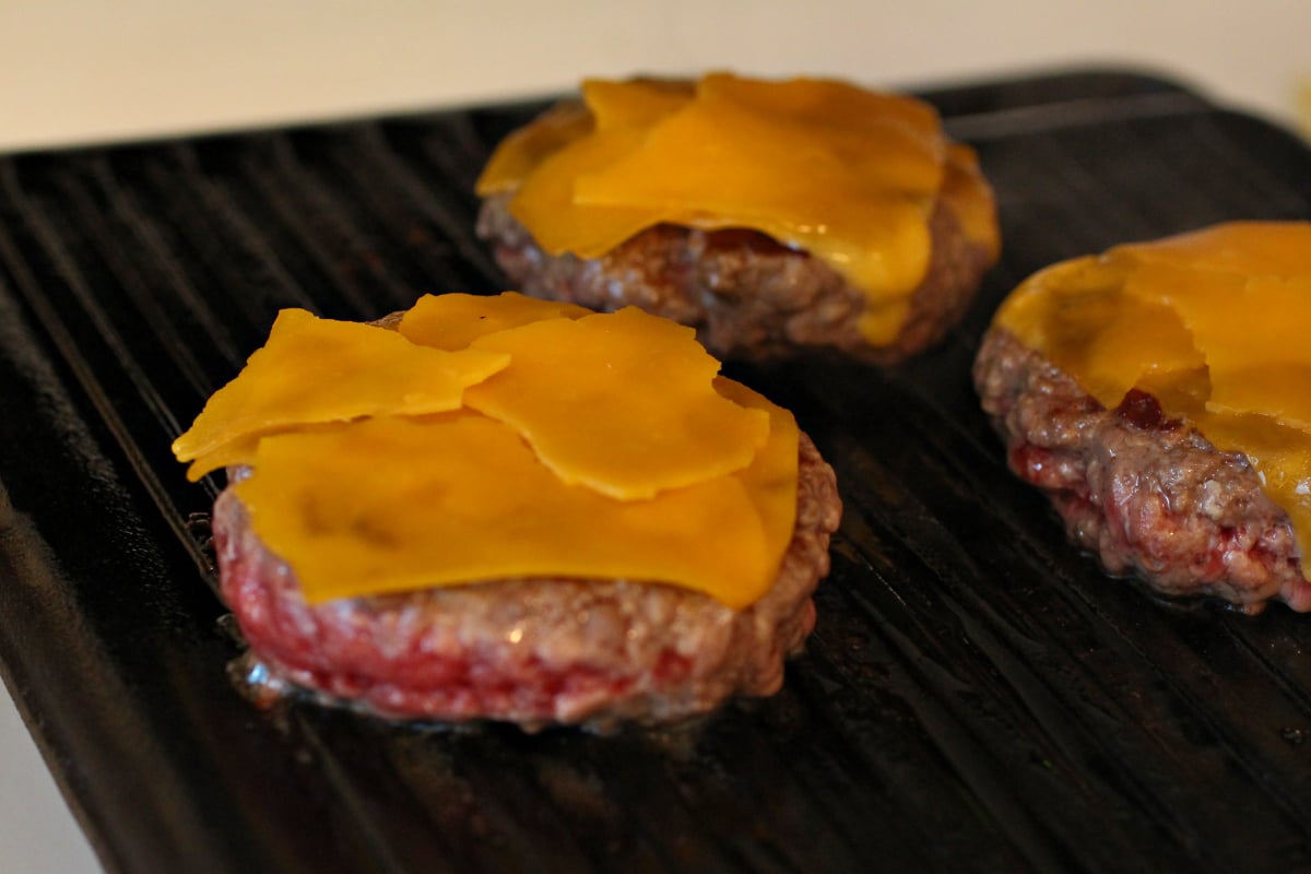 cheeseburgers on the grill