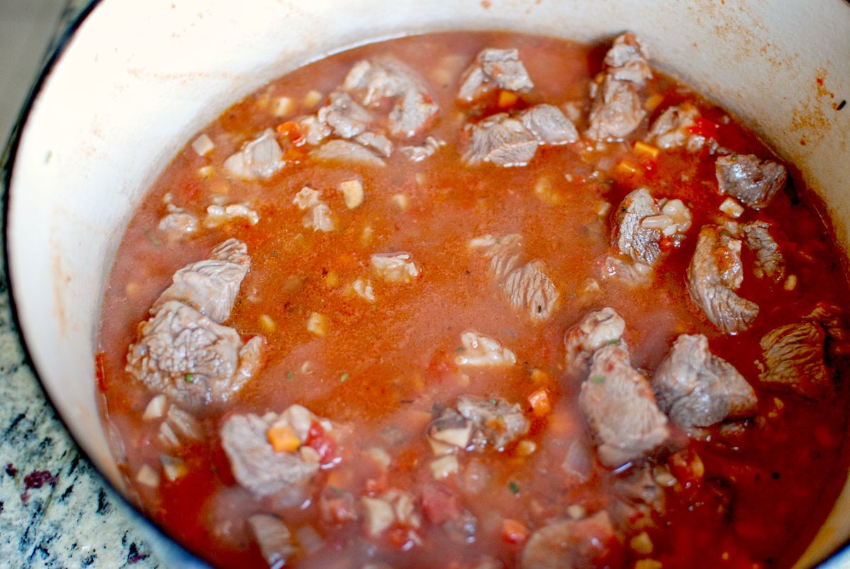 braise the lamb in a gin based sauce 