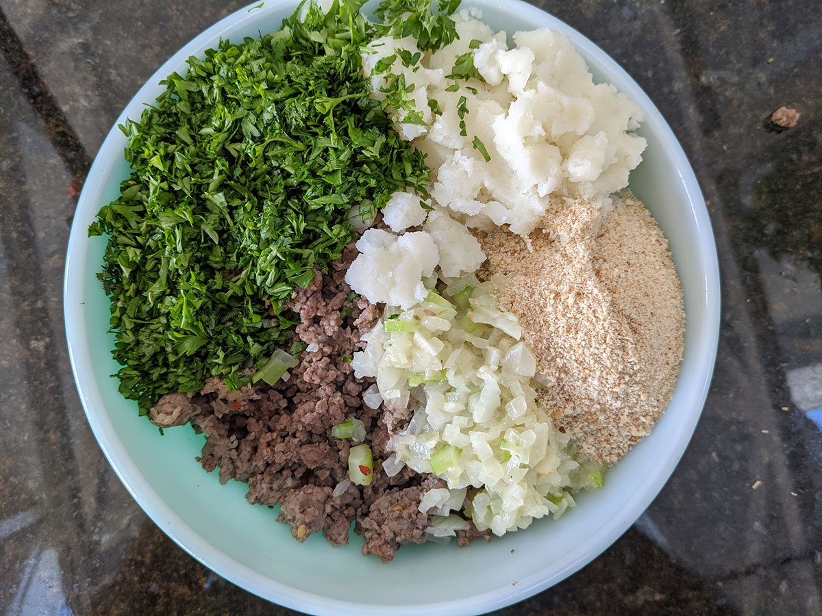 All the ingredients for meat stuffing in a big bowl ready to mix
