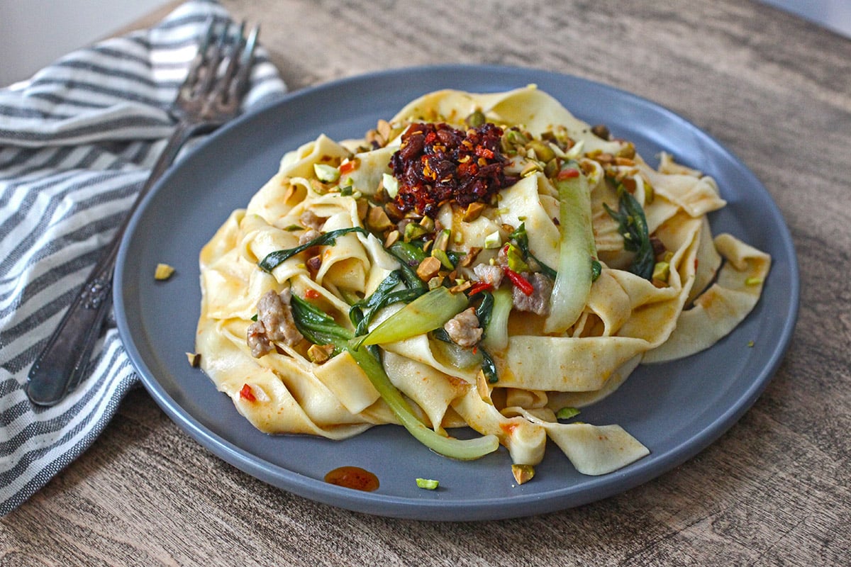 Pork and Coconut Tagliatell with Chili Crisp and Bok Choy